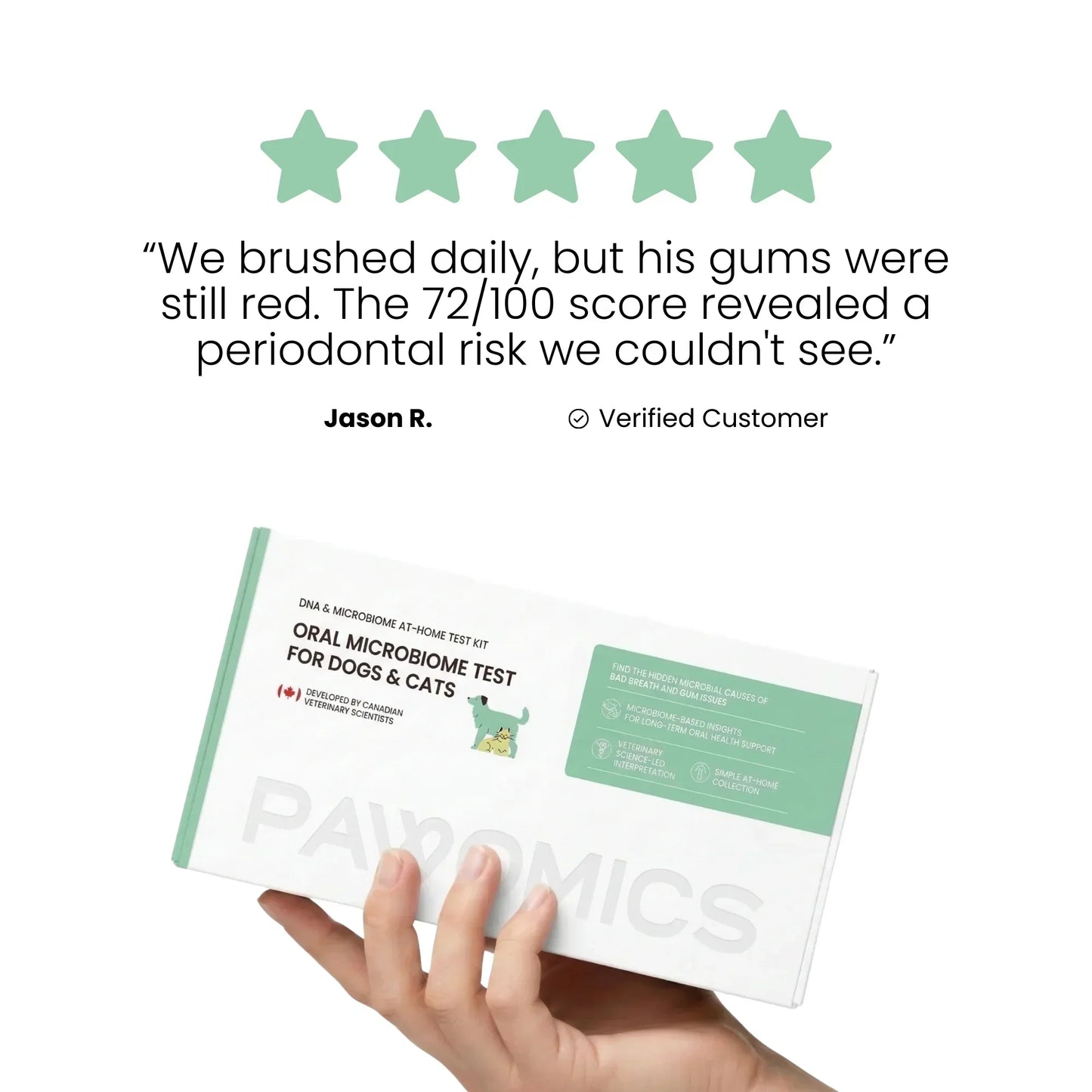 Hand holding a Pawomics oral microbiome test for pets with a five-star rating and customer testimonial on a white background.