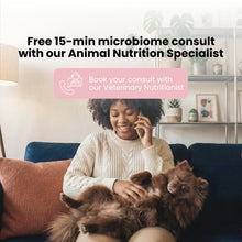 Woman sitting on a couch with a dog, promoting a free 15-minute microbiome consult with an animal nutrition specialist.